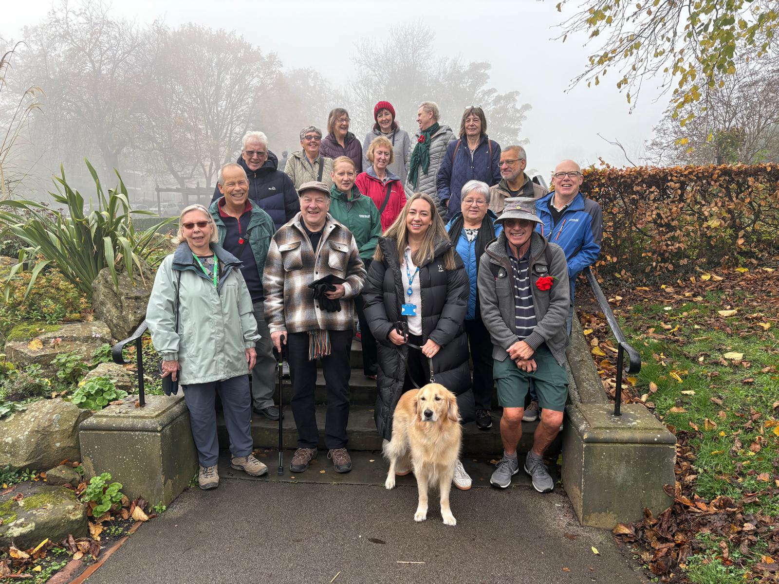 Group picture of men and women in winter clothing enjoying a walk