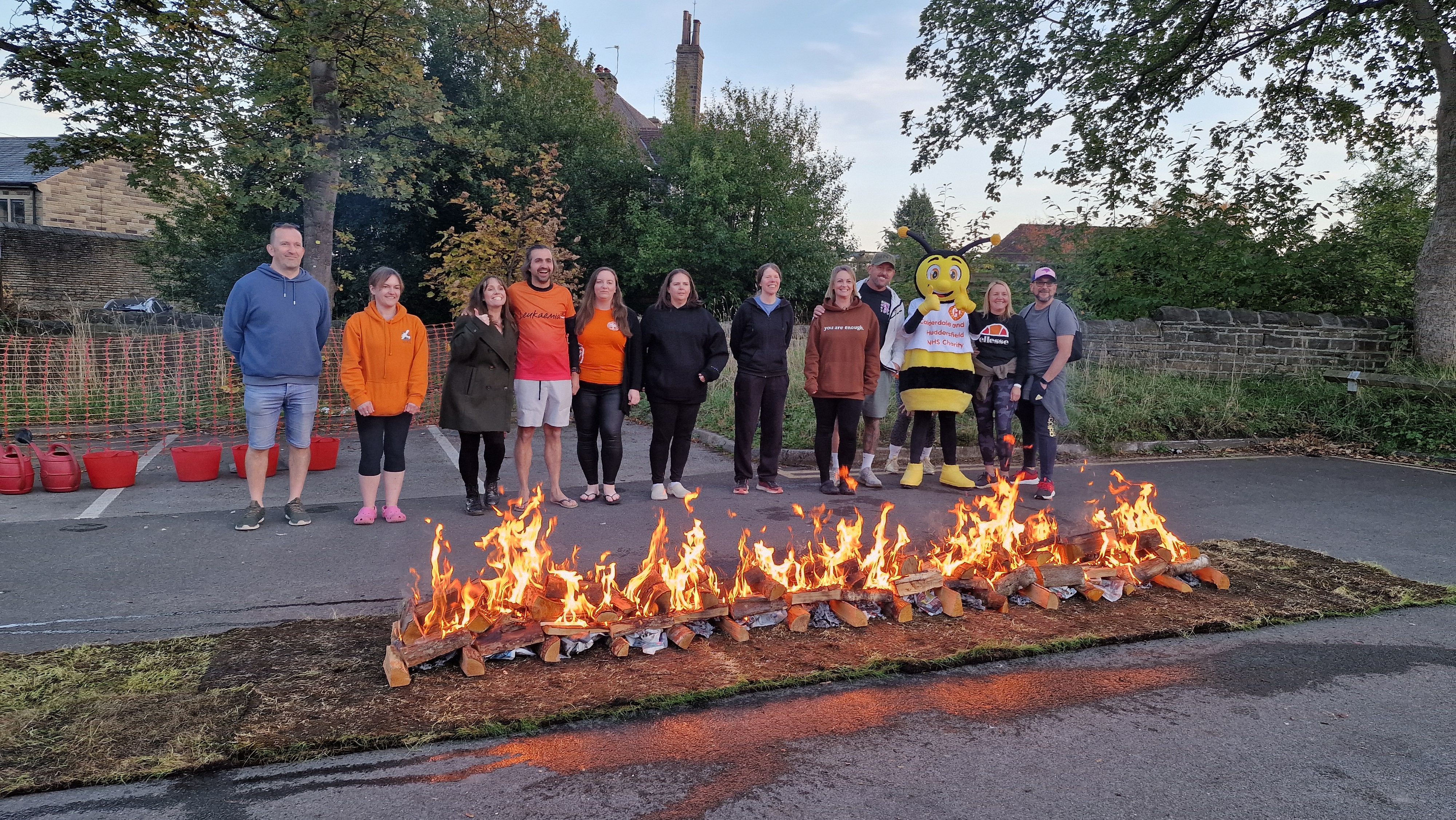 Firewalk participants in front of fire