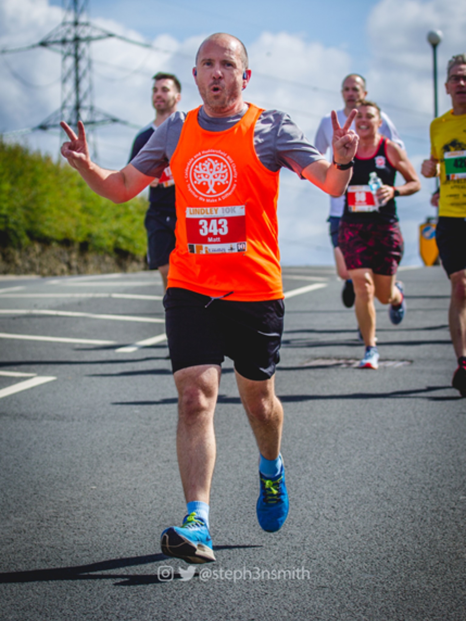 Man running and smiling at the camera