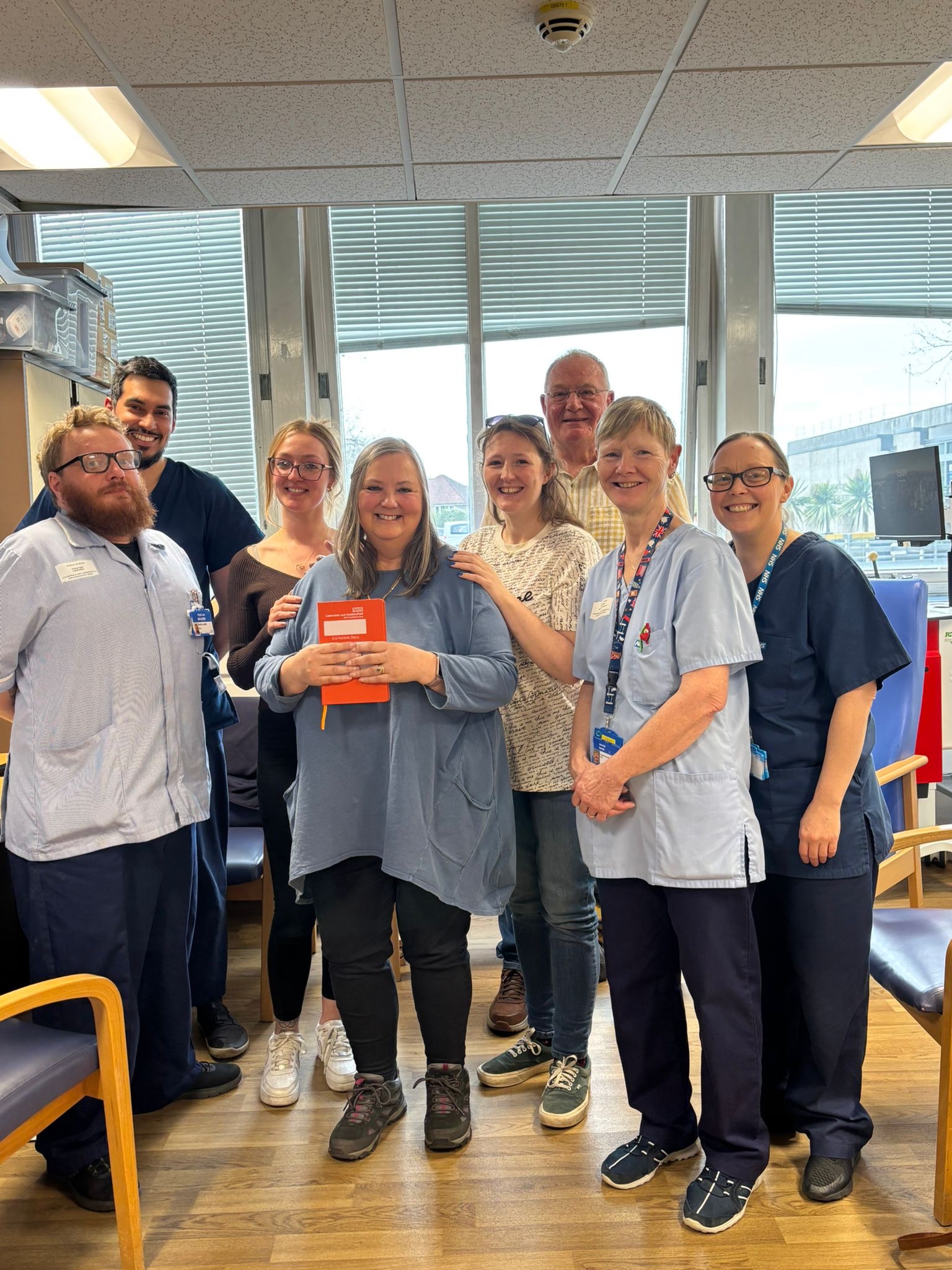 Mandy and her family posing with ICU diary