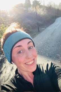 Sophie smiling after running her first ever 10K