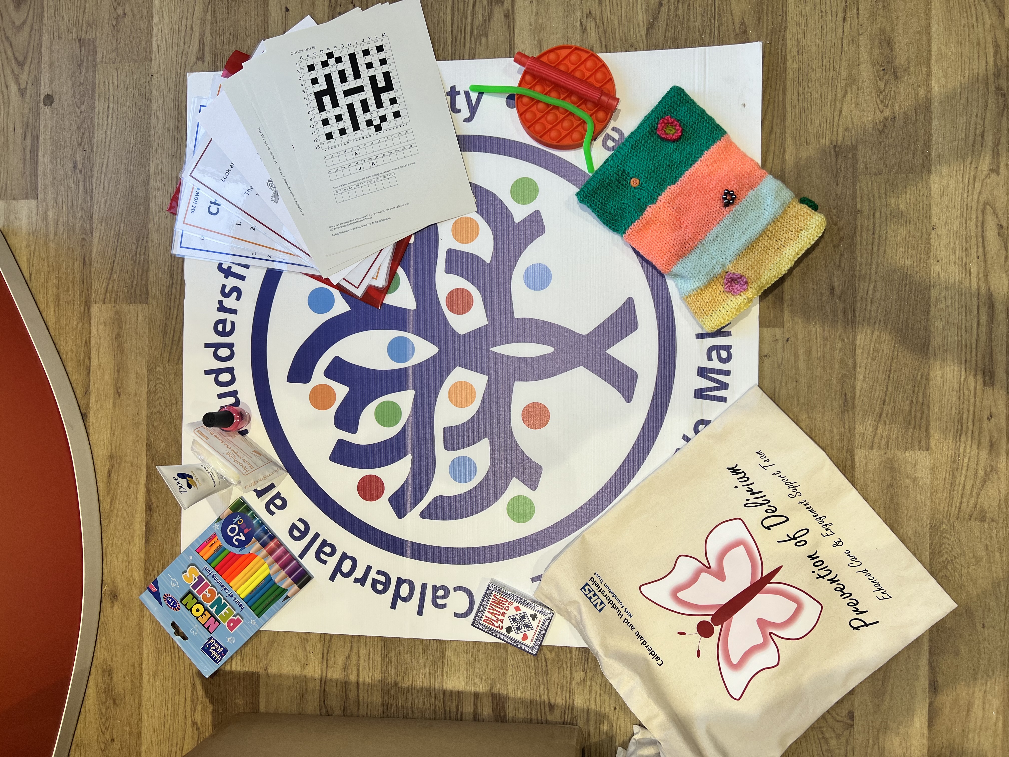 Resources for delirium patients which includes fidget toys, crosswords, playing cards and crayons.